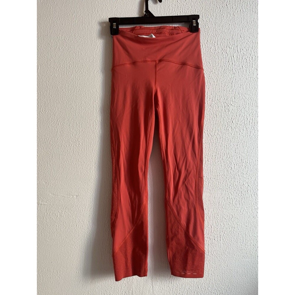 Lululemon leggings Salmon orange with floral detailing Sz 4